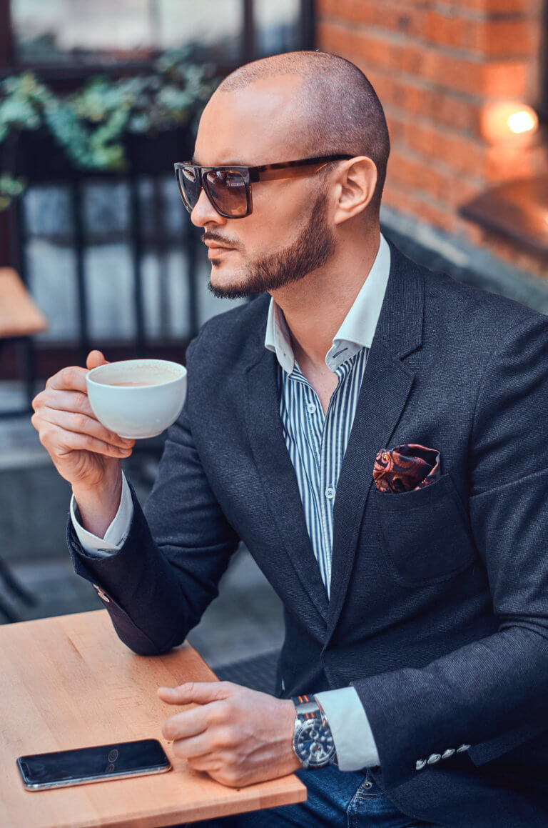 attractive-elegant-businesman-is-sitting-in-cafe-D2NV7CK-768x1159