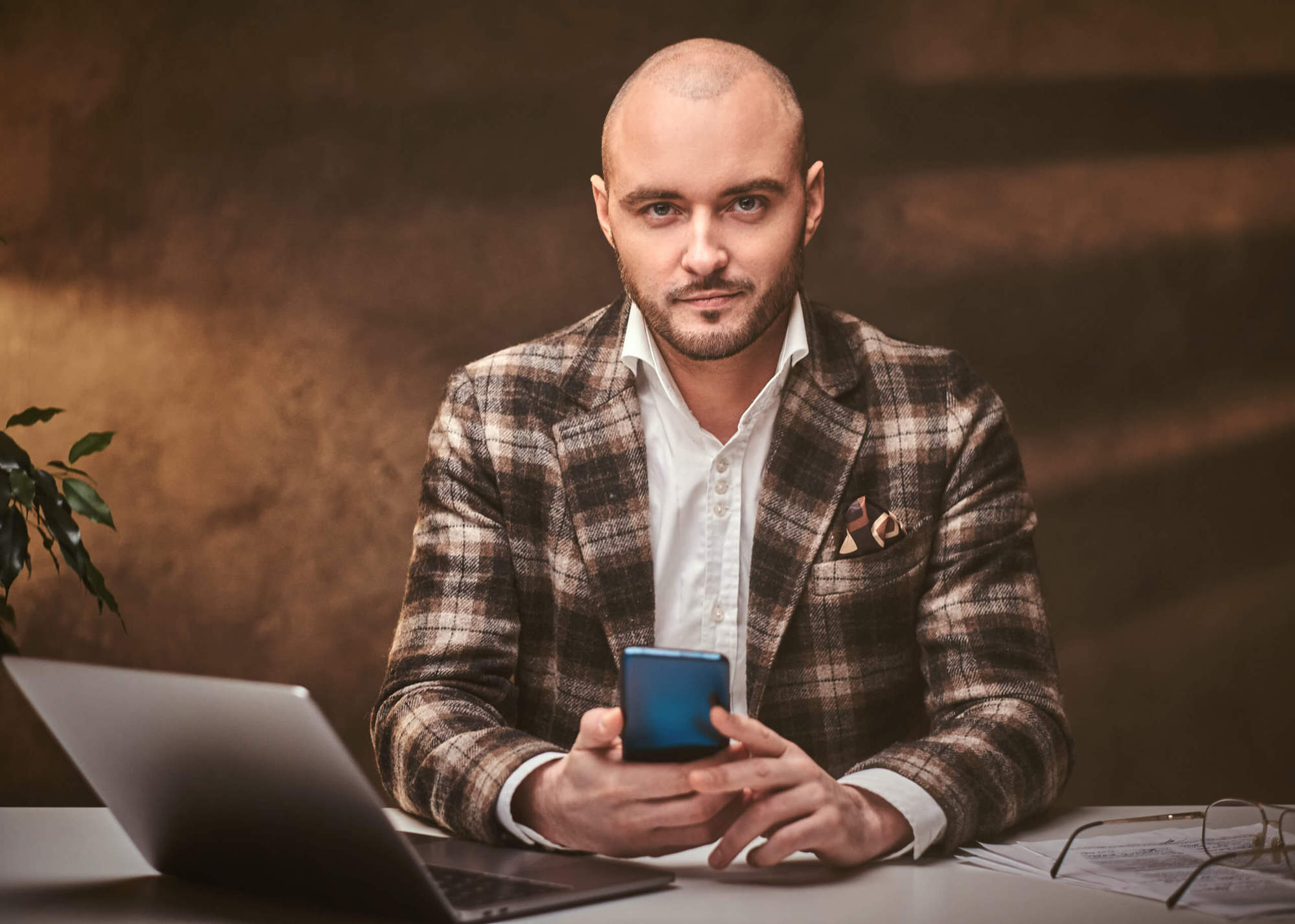 confident-european-handsome-businessman-sitting-in-6U3UNST-scaled